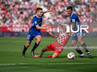 Players are in action during the LaLiga EA Sports match between Girona FC and Athletic Club de Bilbao at Montilivi Stadium in Girona, Spain,...