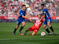 Players are in action during the LaLiga EA Sports match between Girona FC and Athletic Club de Bilbao at Montilivi Stadium in Girona, Spain,...