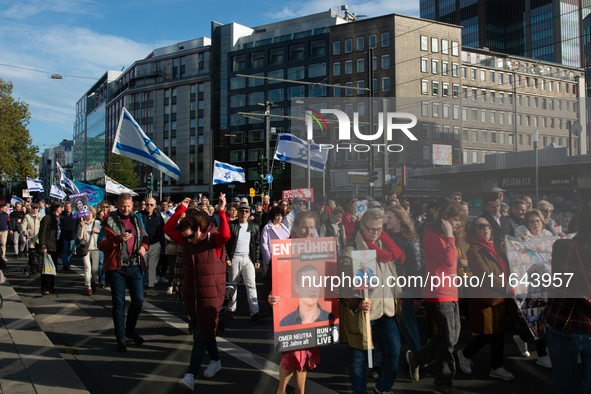 Hundreds of people take part in the ''Bring Them Home'' march to mark the first anniversary of the October 7 Hamas attack, which creates a r...