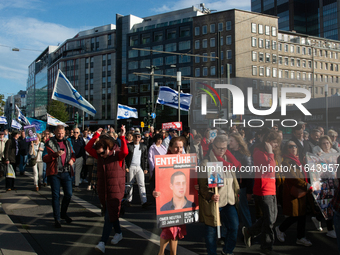 Hundreds of people take part in the ''Bring Them Home'' march to mark the first anniversary of the October 7 Hamas attack, which creates a r...