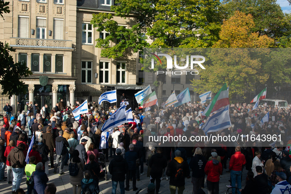 Hundreds of people take part in the ''Bring Them Home'' march to mark the first anniversary of the October 7 Hamas attack, which creates a r...