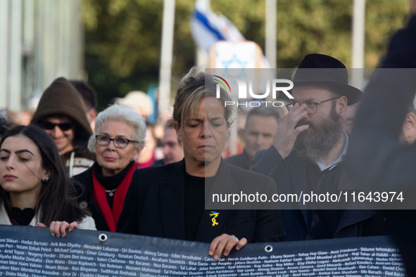 Mona Neubaur, NRW Minister of Economy, takes part in a walk as hundreds of people participate in the ''bring them home'' march to mark the f...