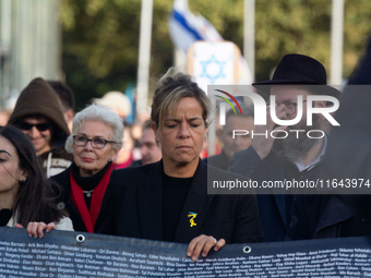 Mona Neubaur, NRW Minister of Economy, takes part in a walk as hundreds of people participate in the ''bring them home'' march to mark the f...