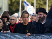 Mona Neubaur, NRW Minister of Economy, takes part in a walk as hundreds of people participate in the ''bring them home'' march to mark the f...