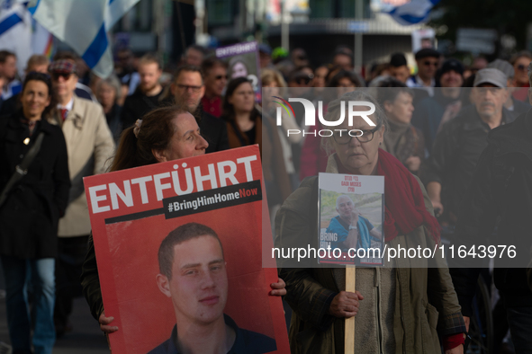 Hundreds of people take part in the ''Bring Them Home'' march to mark the first anniversary of the October 7 Hamas attack, which creates a r...