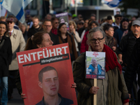 Hundreds of people take part in the ''Bring Them Home'' march to mark the first anniversary of the October 7 Hamas attack, which creates a r...