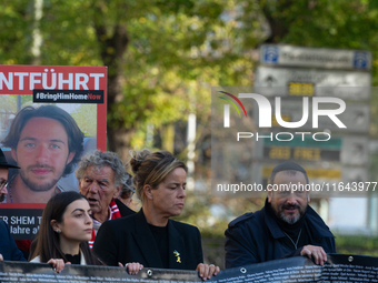 Mona Neubaur, NRW Minister of Economy, takes part in a walk as hundreds of people participate in the ''bring them home'' march to mark the f...