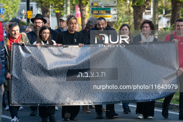 Mona Neubaur, NRW Minister of Economy, takes part in a walk as hundreds of people participate in the ''bring them home'' march to mark the f...