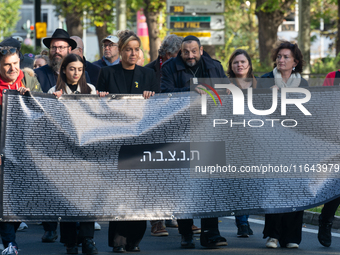 Mona Neubaur, NRW Minister of Economy, takes part in a walk as hundreds of people participate in the ''bring them home'' march to mark the f...