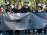 Mona Neubaur, NRW Minister of Economy, takes part in a walk as hundreds of people participate in the ''bring them home'' march to mark the f...