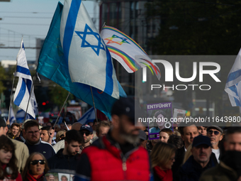 Hundreds of people take part in the ''Bring Them Home'' march to mark the first anniversary of the October 7 Hamas attack, which creates a r...