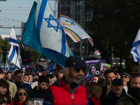 Hundreds of people take part in the ''Bring Them Home'' march to mark the first anniversary of the October 7 Hamas attack, which creates a r...