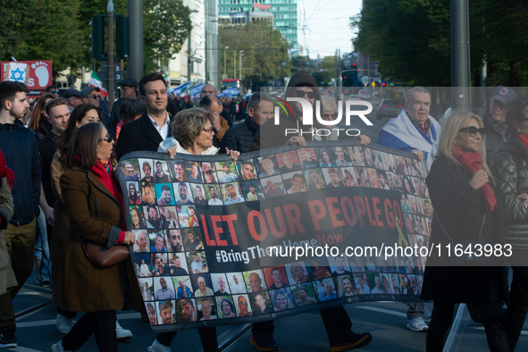 Hundreds of people take part in the ''Bring Them Home'' march to mark the first anniversary of the October 7 Hamas attack, which creates a r...