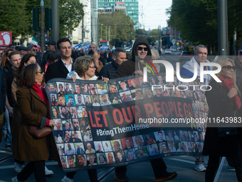 Hundreds of people take part in the ''Bring Them Home'' march to mark the first anniversary of the October 7 Hamas attack, which creates a r...