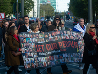 Hundreds of people take part in the ''Bring Them Home'' march to mark the first anniversary of the October 7 Hamas attack, which creates a r...