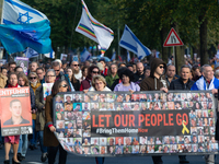 Hundreds of people take part in the ''Bring Them Home'' march to mark the first anniversary of the October 7 Hamas attack, which creates a r...