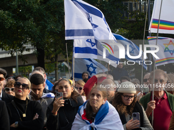 Hundreds of people take part in the ''Bring Them Home'' march to mark the first anniversary of the October 7 Hamas attack, which creates a r...