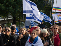 Hundreds of people take part in the ''Bring Them Home'' march to mark the first anniversary of the October 7 Hamas attack, which creates a r...