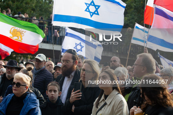 Hundreds of people take part in the ''Bring Them Home'' march to mark the first anniversary of the October 7 Hamas attack, which creates a r...