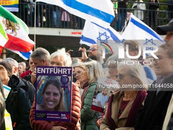 Hundreds of people take part in the ''Bring Them Home'' march to mark the first anniversary of the October 7 Hamas attack, which creates a r...