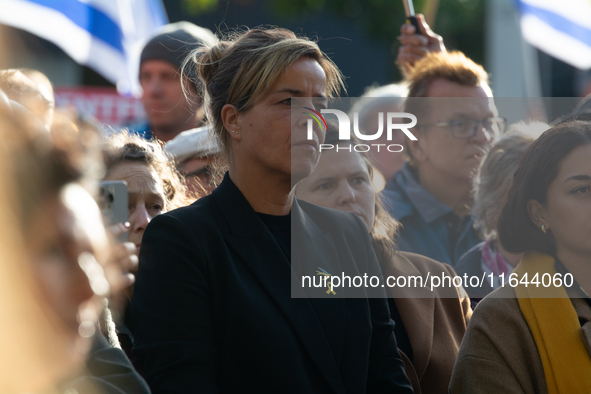 Mona Neubaur, NRW Minister of Economy, takes part in a walk as hundreds of people participate in the ''bring them home'' march to mark the f...