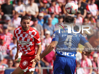 Abel Ruiz and Aitor Paredes play during the match between Girona FC and Athletic Club in week 9 of LaLiga EA Sport at the Montilivi Stadium...