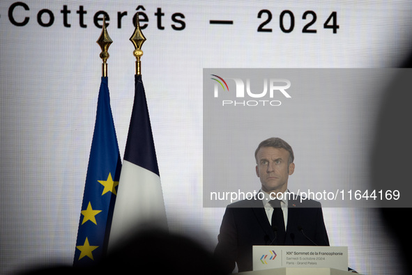 President of the French Republic Emmanuel Macron attends the second and final day of the Francophonie Summit at the Grand Palais in Paris, F...