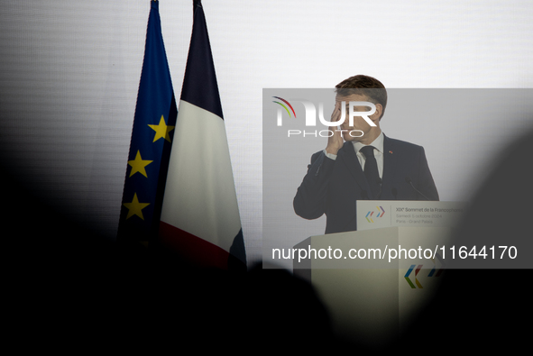 President of the French Republic Emmanuel Macron attends the second and final day of the Francophonie Summit at the Grand Palais in Paris, F...