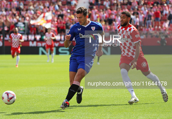 Dani Vivian and Arnaut Danjuma play during the match between Girona FC and Athletic Club in week 9 of LaLiga EA Sport at the Montilivi Stadi...