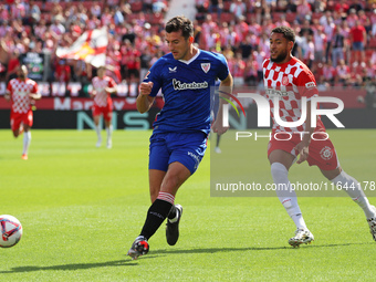 Dani Vivian and Arnaut Danjuma play during the match between Girona FC and Athletic Club in week 9 of LaLiga EA Sport at the Montilivi Stadi...