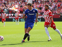 Dani Vivian and Arnaut Danjuma play during the match between Girona FC and Athletic Club in week 9 of LaLiga EA Sport at the Montilivi Stadi...