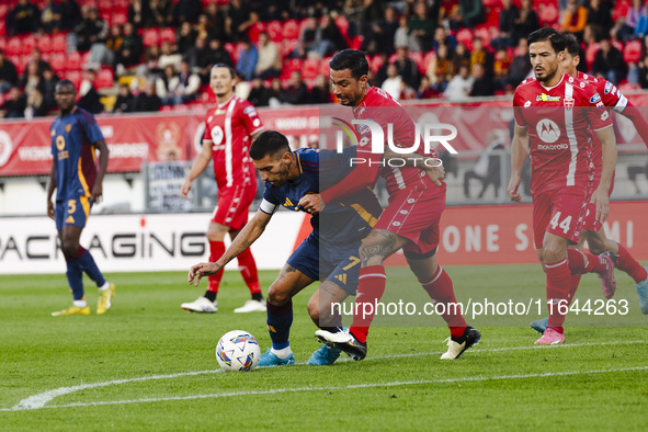 Lorenzo Pellegrini and Armando Izzo are in action during the Serie A match between AC Monza and AS Roma at U-Power Stadium in Monza, Italy,...