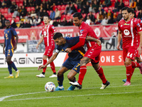 Lorenzo Pellegrini and Armando Izzo are in action during the Serie A match between AC Monza and AS Roma at U-Power Stadium in Monza, Italy,...