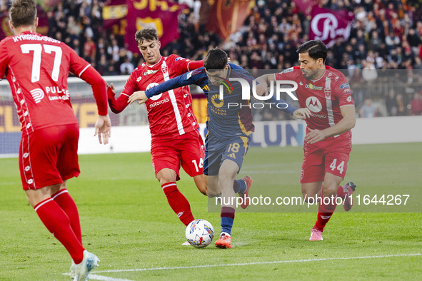 Matias Soule, Daniel Maldini, and Andrea Carboni are in action during the Serie A match between AC Monza and AS Roma at U-Power Stadium in M...