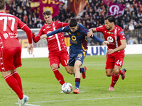 Matias Soule, Daniel Maldini, and Andrea Carboni are in action during the Serie A match between AC Monza and AS Roma at U-Power Stadium in M...