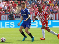 Oihan Sancet and Arnaut Danjuma play during the match between Girona FC and Athletic Club, corresponding to week 9 of LaLiga EA Sport, at th...