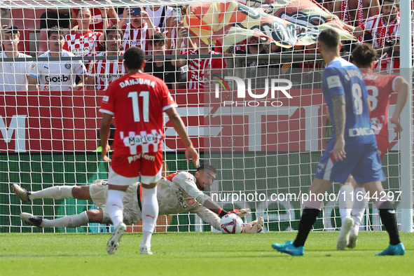 Paulo Gazzaniga stops a penalty during the match between Girona FC and Athletic Club in week 9 of LaLiga EA Sport at the Montilivi Stadium i...