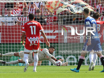 Paulo Gazzaniga stops a penalty during the match between Girona FC and Athletic Club in week 9 of LaLiga EA Sport at the Montilivi Stadium i...