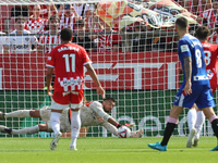 Paulo Gazzaniga stops a penalty during the match between Girona FC and Athletic Club in week 9 of LaLiga EA Sport at the Montilivi Stadium i...