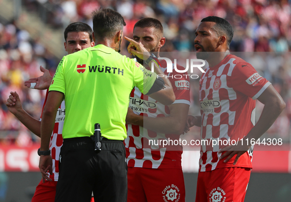 The referee Juan Luis Pulido Santana officiates the match between Girona FC and Athletic Club, corresponding to week 9 of LaLiga EA Sport, a...