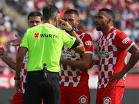 The referee Juan Luis Pulido Santana officiates the match between Girona FC and Athletic Club, corresponding to week 9 of LaLiga EA Sport, a...