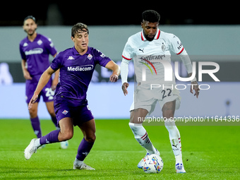 Emerson Royal of AC Milan and Edoardo Bove of ACF Fiorentina compete for the ball during the Serie A Enilive match between ACF Fiorentina an...