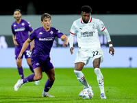 Emerson Royal of AC Milan and Edoardo Bove of ACF Fiorentina compete for the ball during the Serie A Enilive match between ACF Fiorentina an...