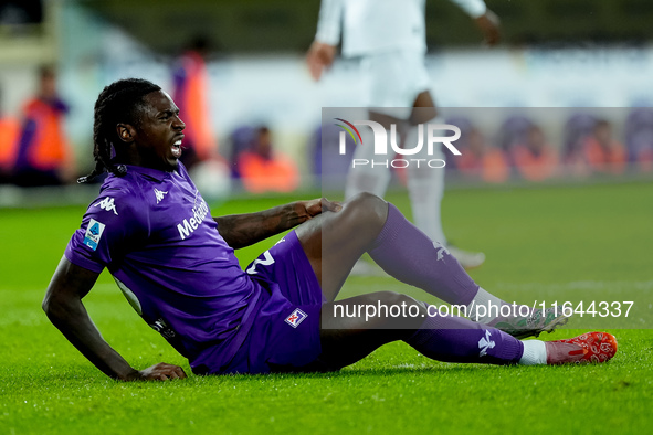 Moise Kean of ACF Fiorentina lies down injured during the Serie A Enilive match between ACF Fiorentina and AC Milan at Stadio Artemio Franch...