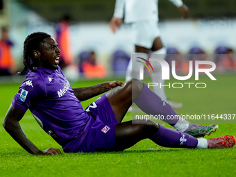 Moise Kean of ACF Fiorentina lies down injured during the Serie A Enilive match between ACF Fiorentina and AC Milan at Stadio Artemio Franch...