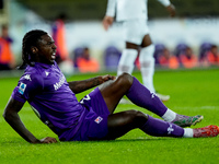 Moise Kean of ACF Fiorentina lies down injured during the Serie A Enilive match between ACF Fiorentina and AC Milan at Stadio Artemio Franch...