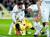 Mike Maignan of AC Milan celebrates with Alvaro Morata of AC Milan and Theo Hernandez of AC Milan after saving the penalty kick during the S...