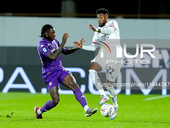 Moise Kean of ACF Fiorentina and Emerson Royal of AC Milan compete for the ball during the Serie A Enilive match between ACF Fiorentina and...