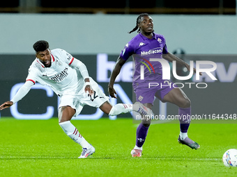 Moise Kean of ACF Fiorentina and Emerson Royal of AC Milan compete for the ball during the Serie A Enilive match between ACF Fiorentina and...