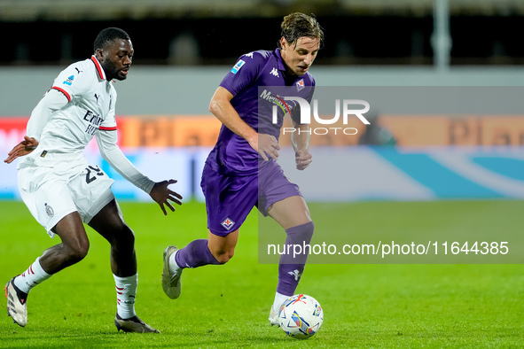 Youssouf Fofana of AC Milan and Edoardo Bove of ACF Fiorentina compete for the ball during the Serie A Enilive match between ACF Fiorentina...